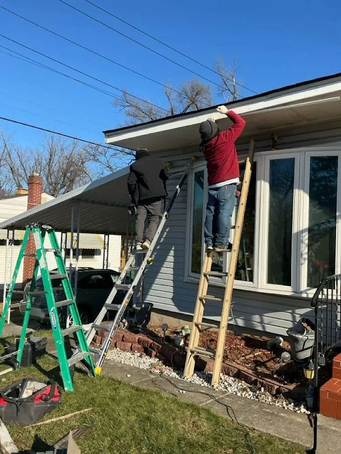 Restoration crew performing exterior repair in East Windsor